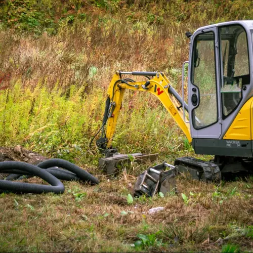 Mini excavator on a drainage job
