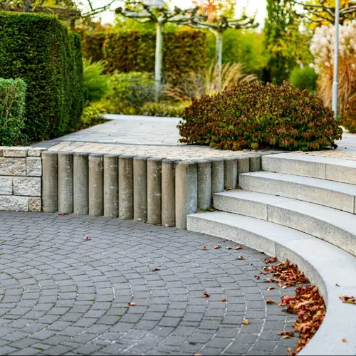 Curved concrete steps beside paving